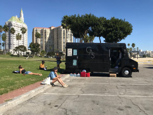 lounging on grass beside Gas