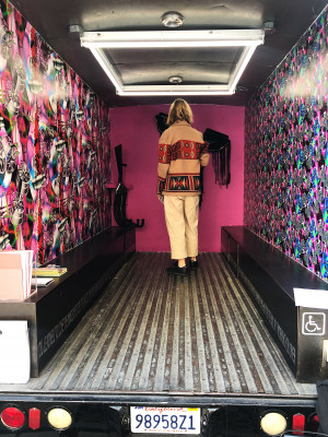 standing inside Gas looking at artwork