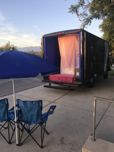 Gas open, parked adjacent to camp chairs
