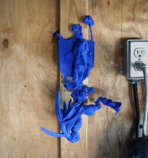 blue clay sculpture adjacent to outlet