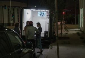 people in back of Gas looking at artwork