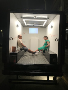 2 people sitting in back of Gas gallery benches